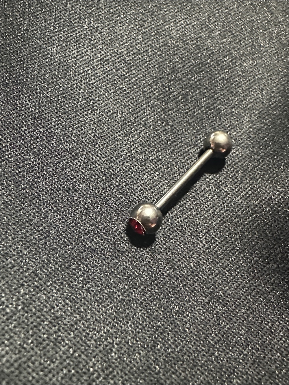 Silver Barbell Piercing with Red Gem